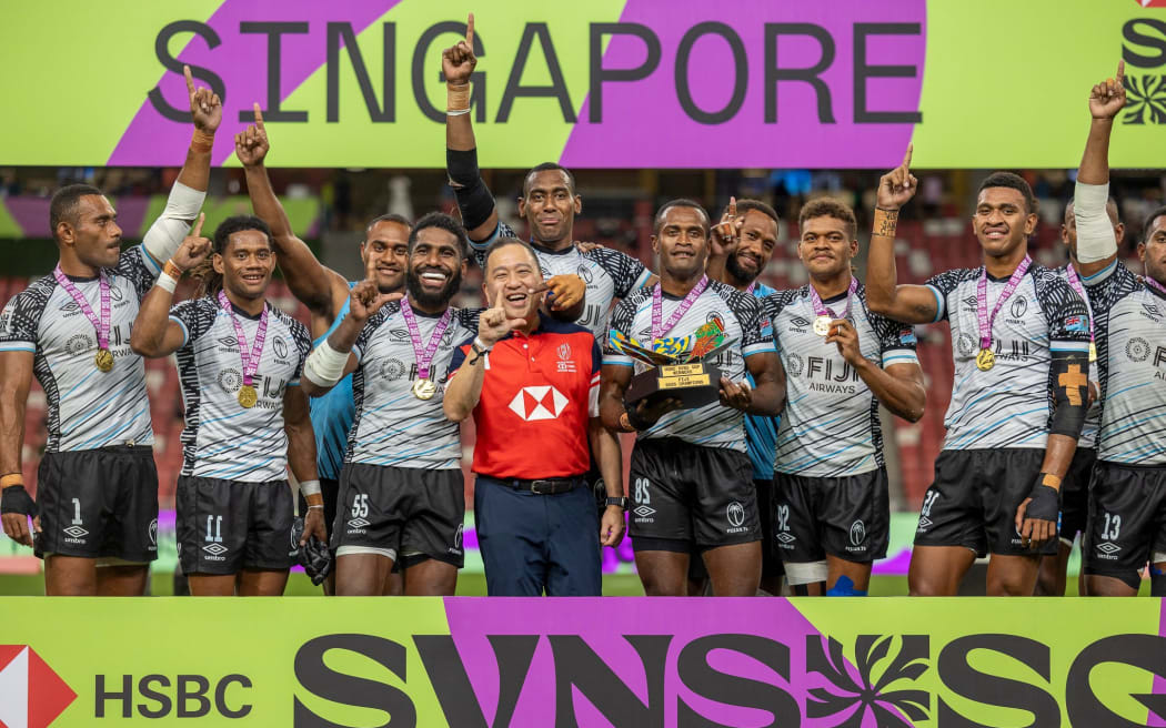 SINGAPORE - April 6: Fiji men celebrate their Cup victory at the 2025 HSBC SVNS Singapore at Singapore National Stadium on April 6, 2025 in Singapore. (Photo by Zach Franzen / World Rugby)