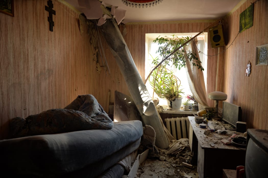 The body of a rocket stuck in a flat after recent shelling on the northern outskirts of Kharkiv on February 24, 2022.