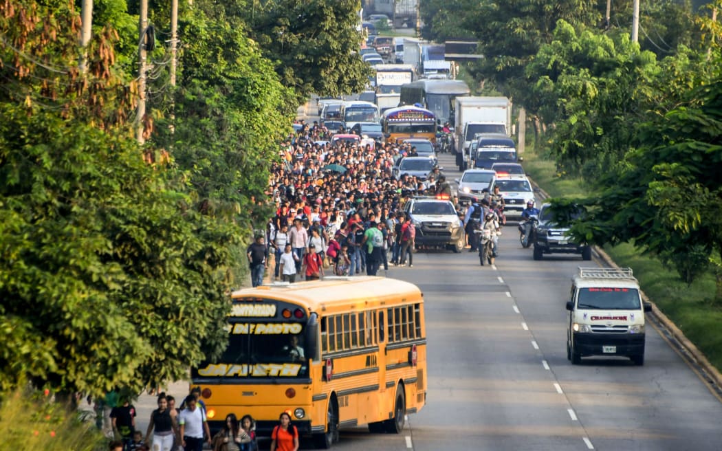 Hondurans walk towards the US from San Pedro Sula, 180 kms north from Tegucigalpa