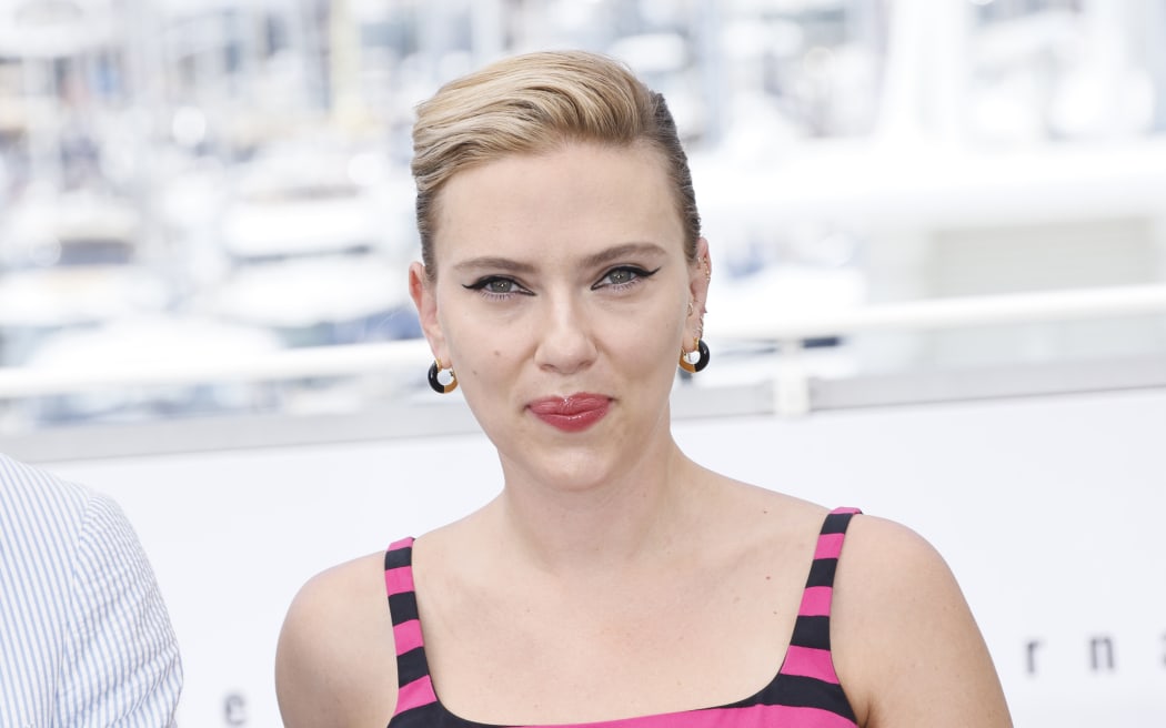 FILE - Scarlett Johansson poses for photographers at the photo call for the film "Asteroid City" at the 76th international film festival, Cannes, southern France, May 24, 2023. OpenAI plans to halt the use of one of its ChatGPT voices after some drew similarities to Johansson, who famously portrayed a fictional AI assistant in the (perhaps no longer so futuristic) film “Her.” (Photo by Joel C Ryan/Invision/AP, File)