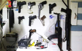 A picture released by the Italian police showing arms found during the anti-mafia operation.