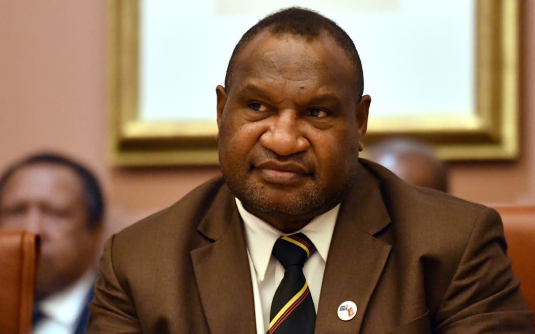 Papua New Guinea's Prime Minister James Marape listens to Australia's Prime Minister Scott Morrison during a meeting at Parliament House in Canberra on July 22, 2019. - Marape is on a six-day visit to Australia. (Photo by MICK TSIKAS / POOL / AFP)