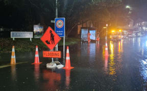 Contractors are out dealing with surface flooding outside St Michael's Church on Upland Road, in Kelburn, Wellington.
