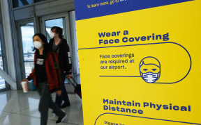 People entering John F Kennedy Airport on Tuesday in New York City.