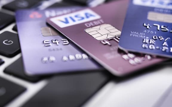 Credit card on laptop illustrating online shopping and banking.