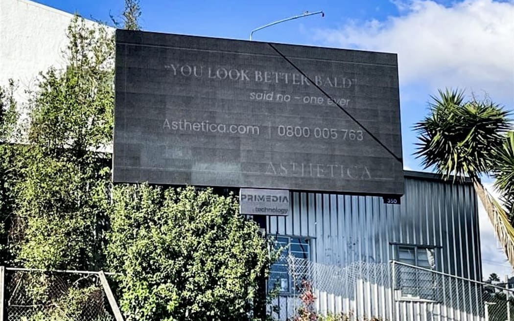 A digital billboard on display in Kingsland for Asthetica.
