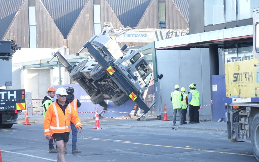 A crane on a construction site in Christchurch crashes and closes Victoria street.