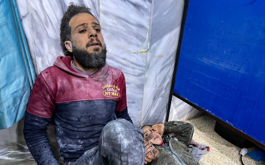 An injured child await treatment at the emergency ward of the Bab al-Hawa hospital following an earthquake, in the rebel-held northern countryside of Syria's Idlib province on the border with Turkey.