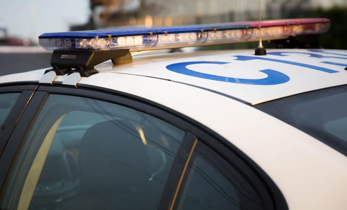 A police car at a cordon.
