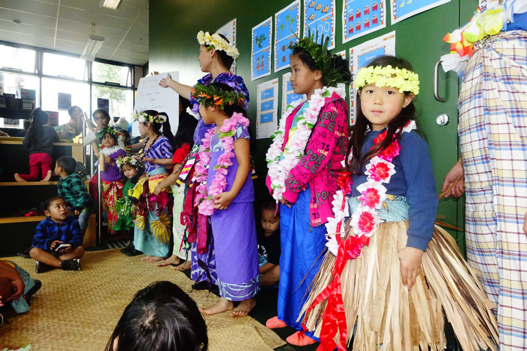Children prepare a Tuvaluan song to perform.