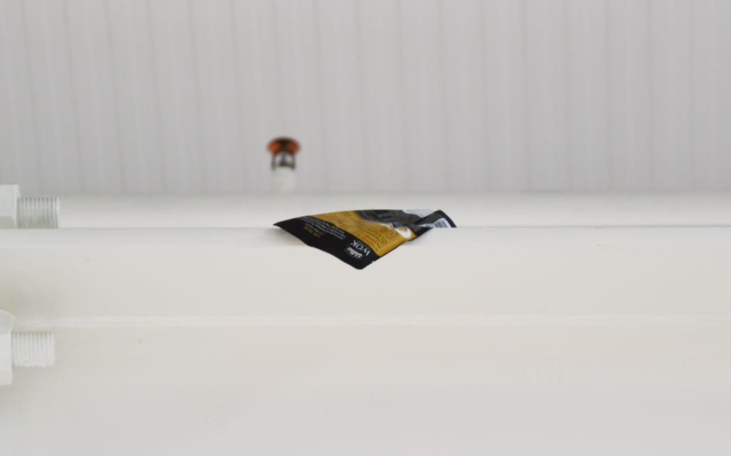 Close up of a sauce packet on the roof of a supermarket