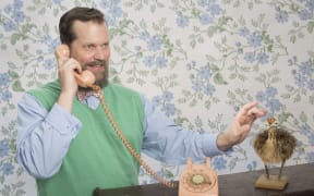 John Grant with phone and ostrich