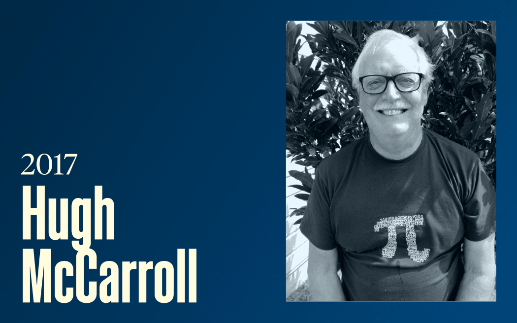 A smiling man wearing classes and a pi t-shirt, text reads "2017, Hugh McCarroll"