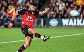 Richie Mo'unga with a clearing kick during the 2023 Super Rugby Pacific Final against the Chiefs at FMG Stadium, Hamilton. Mandatory credit: Andrew Cornaga / www.photosport.nz