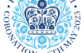 Round logo design with crown and flowers central, words around the outer circle: King Charles III Coronation 6th May 2023.