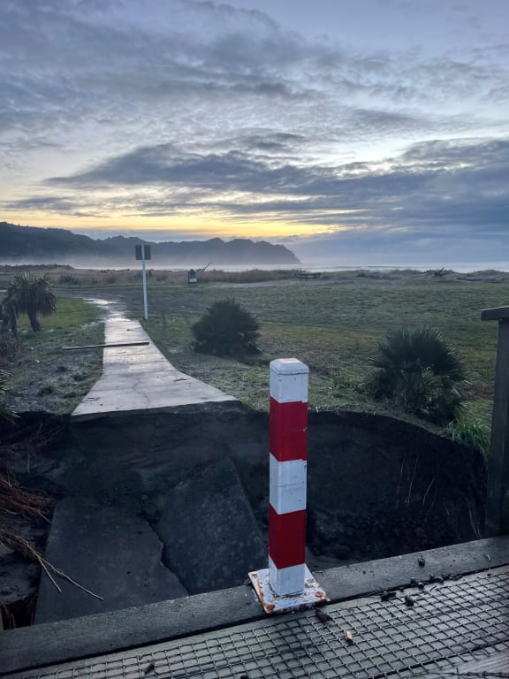 A bridge collapsed by flooding in Tokomaru Bay.