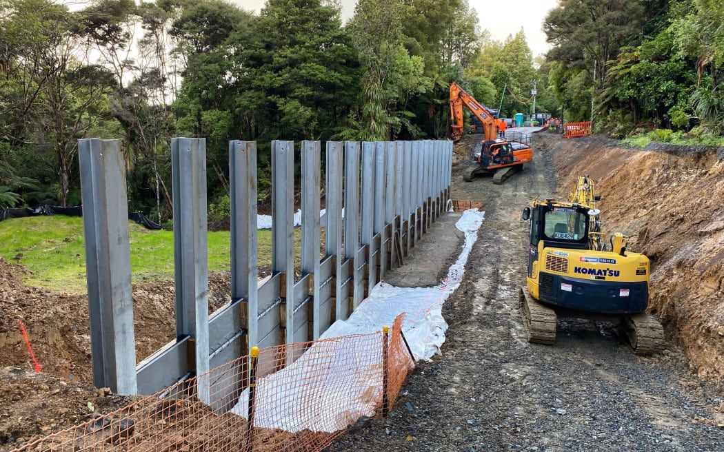 Giant metal piles - some up to 20m long - are inserted into the ground to stabilise a slip on Scenic Drive.