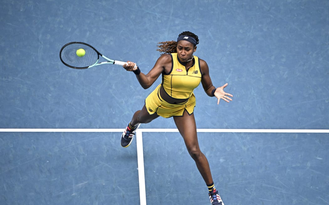 Coco Gauff hits a return against Poland's Magdalena Frech during their women's singles match.