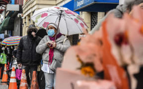 People queue at a community kitchen Harlem, New York City.