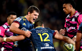 Dillon Hunt of the Highlanders celebrates with Sio Tomkinson after his try, during the Super Rugby Aotearoa match between the Highlanders and the Chiefs in Dunedin