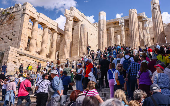 Crowds of tourists enter Propylaea, the entrance of the Athenian Acropolis in Athens, Greece on March 14th, 2024. (Photo by Beata Zawrzel/NurPhoto) (Photo by Beata Zawrzel / NurPhoto / NurPhoto via AFP)