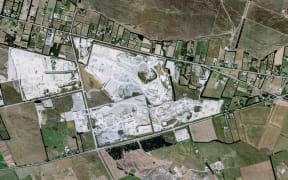 An aerial view of the Winstones quarry on Old West Coast Road, and the houses nearby.
