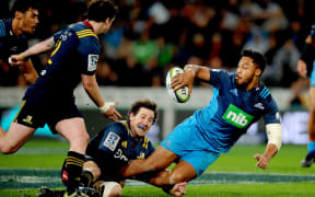 George Moala of the Blues off loads, during the Super Rugby match between the Highlanders and the Blues, held at Forsyth Barr Stadium in Dunedin.