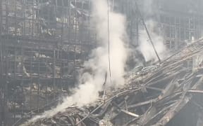 This video grab taken from a handout footage released by the Russian Investigative Committee on March 23, 2024 shows a view of the Crocus City Hall, a day after a gun attack in Krasnogorsk, outside Moscow. Camouflaged assailants opened fire at the packed Crocus City Hall in Moscow's northern suburb of Krasnogorsk on March 22, 2024, evening ahead of a concert by Soviet-era rock band Piknik in the deadliest attack in Russia for at least a decade. Russia on March 23, 2024, said it had arrested 11 people - including four gunmen - over the attack on a Moscow concert hall claimed by Islamic State, as the death toll rose to over 100 people. (Photo by Handout / RUSSIAN INVESTIGATIVE COMMITTEE / AFP) / RESTRICTED TO EDITORIAL USE - MANDATORY CREDIT "AFP PHOTO / HANDOUT / RUSSIAN INVESTIGATIVE COMMITTEE" - NO MARKETING NO ADVERTISING CAMPAIGNS - DISTRIBUTED AS A SERVICE TO CLIENTS
