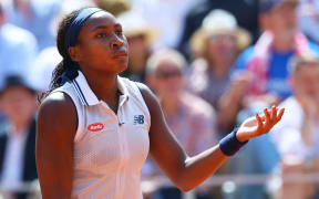 US tennis player Coco Gauff reacts during her women's singles semi final match against Poland's Iga Swiatek at the 2024 French Open.