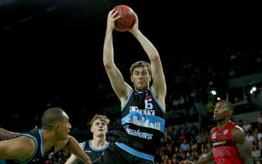 Breakers big man Rob Loe reaches for the ball during a NBL match against the Perth Wildcats.
