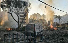 Fires erupt from buildings damaged in an early morning Israeli strike on Beirut’s southern suburbs on March 3, 2026. The Israeli military issued new evacuation orders for dozens of locations in Lebanon on March 3, including warning residents in two southern Beirut neighbourhoods to stay away from several buildings ahead of an imminent operation. (Photo by AFP)