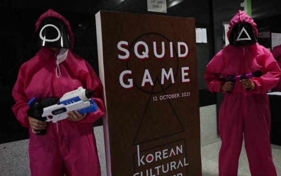 Participants take part in an event where they play the games of Netflix smash hit "Squid Game" at the Korean Cultural Centre in Abu Dhabi, on October 12, 2021.