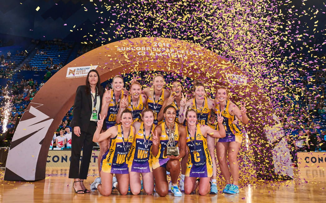 Sunshine Coast Lightning celebrate with coach Noeline Taurua after winning the 2018 final