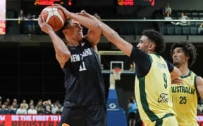 Tall Blacks Flynn Cameron (L) with Australia Jaylin Galloway during the FIBA World Cup Qualifier - New Zealand Tall Blacks v Australia Boomers at TSB Arena, Wellington, on 1 December 2025.