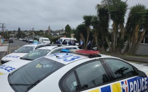 Police on Bardia Street in Belmont, Auckland.