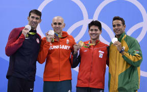 Singapore's Schooling Joseph (2nd on the Right) poses with silver medallists (from Left) USA's Michael Phelps, Hungary's Laszlo Cseh and South Africa's Chad Guy Bertrand Le Clos.