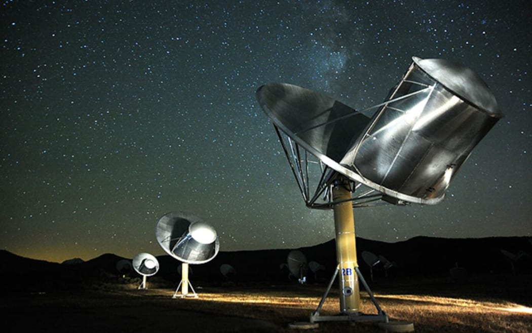 The Allen Telescope Array at night with stars above.