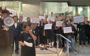 Two dozen people protested on the steps of the Auckland Council offices this morning demanding compensation.