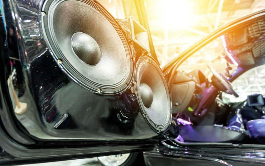 Speakers in a sport car in the sunlight