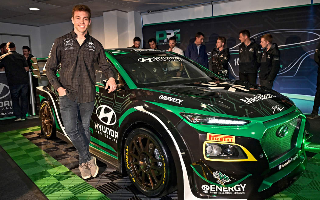 New Zealand rally driver Hayden Paddon with his Hyundai EV rally car.