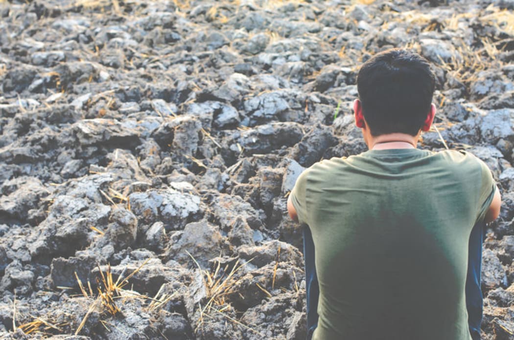 Man looking into the distance.