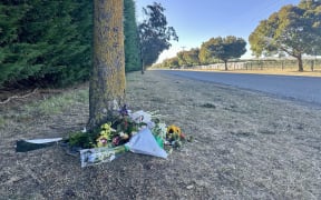 Wreaths laid at the scene of the crash on Pūruatanga Road.