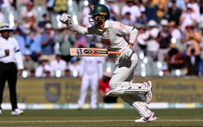 Australian batsman Alex Carey celebrates scoring a century on the first day of the third Ashes cricket Test match between Australia and England at the Adelaide Oval in Adelaide on December 17, 2025. (Photo by William WEST / AFP) / --IMAGE RESTRICTED TO EDITORIAL USE - STRICTLY NO COMMERCIAL USE--