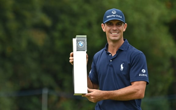 US golfer Billy Horschel poses with the trophy after his victory in the PGA Championship at Wentworth Golf Club in Surrey, south west of London on September 12, 2021.