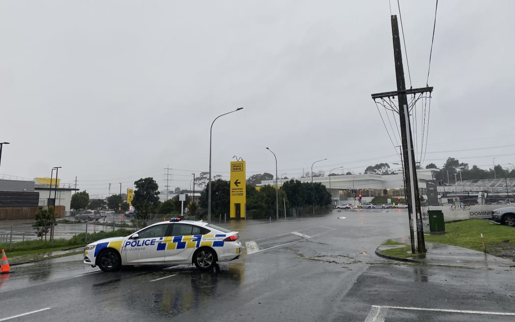 Porana Road closed at Wairau Road end due to flooding in Auckland on 9 May 2023.