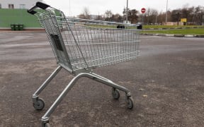 Empty grocery cart from a supermarket on the street