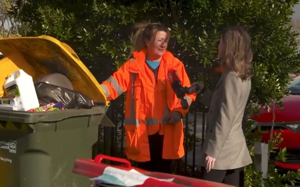 Roz Millett (left) tells Checkpoint's Louise Ternouth that there has been an increase in the number of recycling bins which cannot be picked up because they contain items that contaminate the recycling.