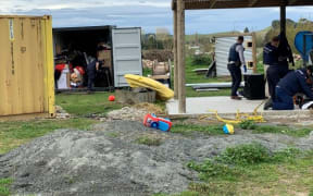 Police staff search a property in Wairoa today.