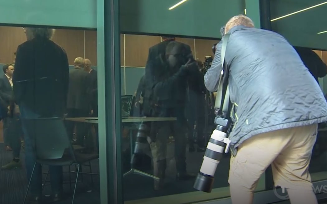 Media excluded from Auckland mayor Wayne Brown's briefing on budget proposals last Thursday  - reduced to peeking through the windows.