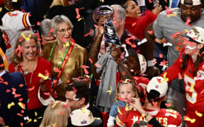 Kansas City Chiefs' wide reciever #12 Mecole Hardman holds the trophy after winning Super Bowl LVIII against the San Francisco 49ers at Allegiant Stadium in Las Vegas, Nevada, February 11, 2024. (Photo by Patrick T. Fallon / AFP)
